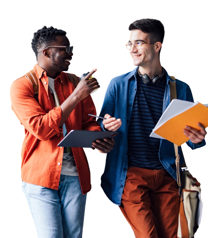 Two young men engaged in a lively conversation while holding notebooks.