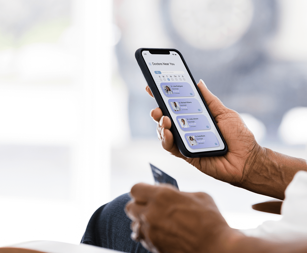 Hands holding smartphone and card